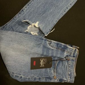 Levi’s 501 Original non-stretch straight leg distressed jeans.